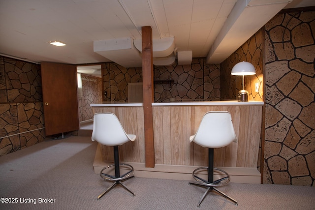 bar featuring pendant lighting and carpet flooring