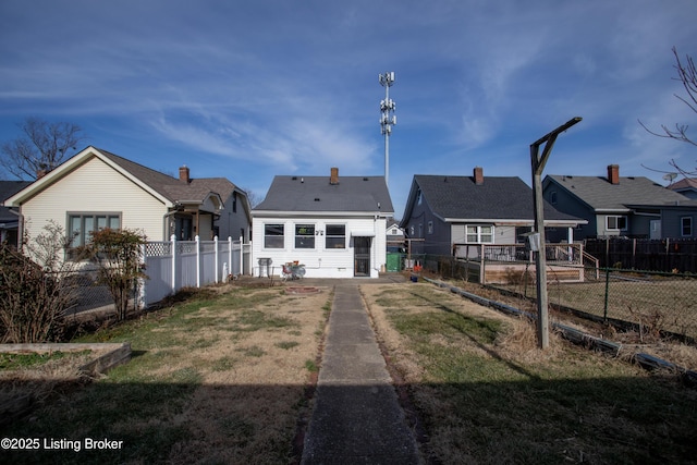 back of house with a yard