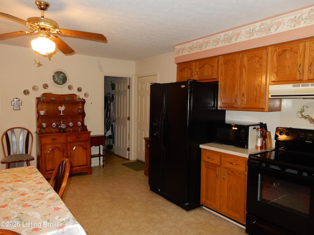 kitchen with a textured ceiling, ceiling fan, and black appliances