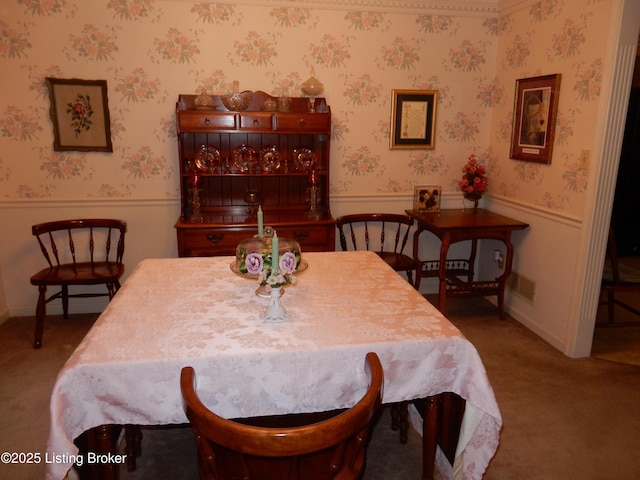 dining space featuring carpet