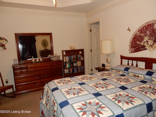 bedroom featuring crown molding and dark carpet