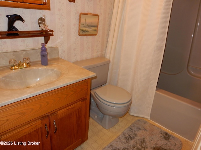 full bathroom with vanity, toilet, and shower / tub combo with curtain