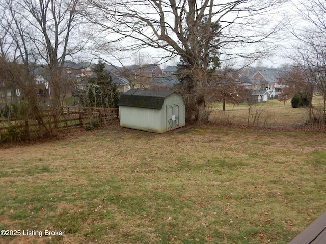 view of yard featuring a storage unit