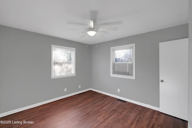 spare room with wood-type flooring and ceiling fan