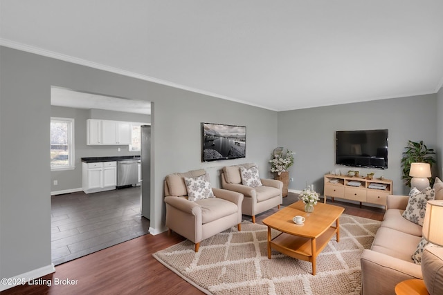 living room with ornamental molding and dark hardwood / wood-style floors