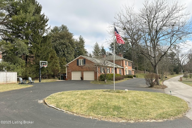 view of front of house featuring a garage and a front yard