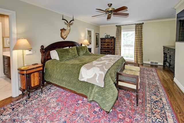 bedroom featuring crown molding, hardwood / wood-style floors, and ceiling fan