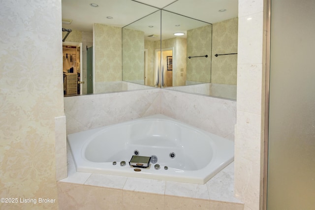 bathroom featuring tiled tub