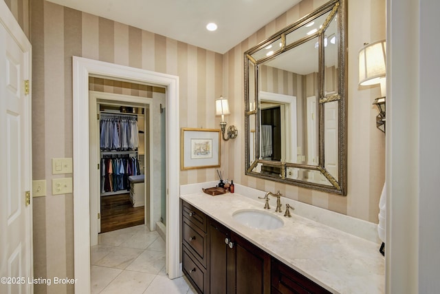 bathroom featuring tile patterned flooring and vanity