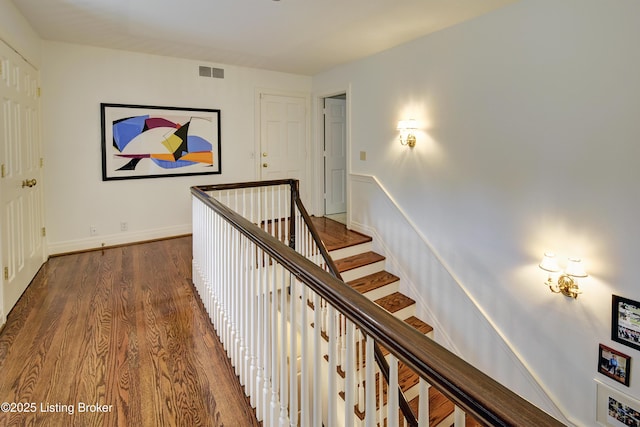 hallway featuring dark hardwood / wood-style flooring