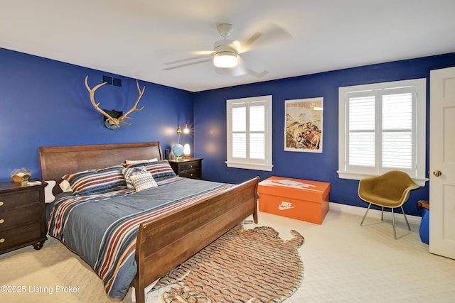 carpeted bedroom with ceiling fan