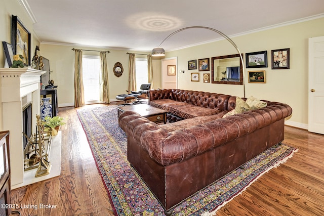 living room with crown molding and light wood-type flooring