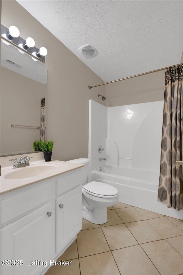 full bathroom with toilet, shower / tub combo, a textured ceiling, vanity, and tile patterned flooring