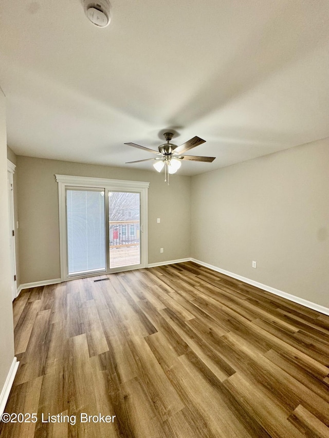 empty room with ceiling fan and light wood-type flooring