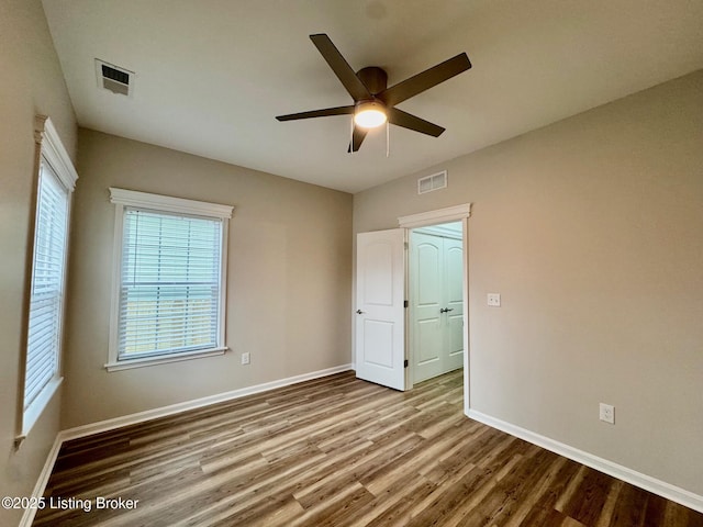 spare room with ceiling fan and light hardwood / wood-style flooring