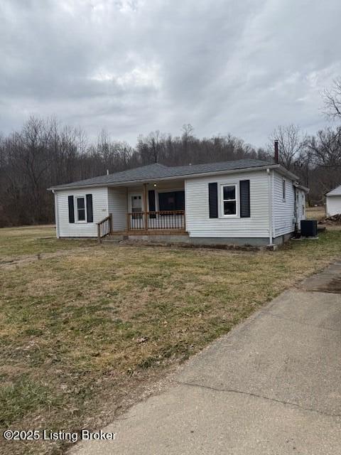 view of front of property featuring a porch, central air condition unit, and a front lawn