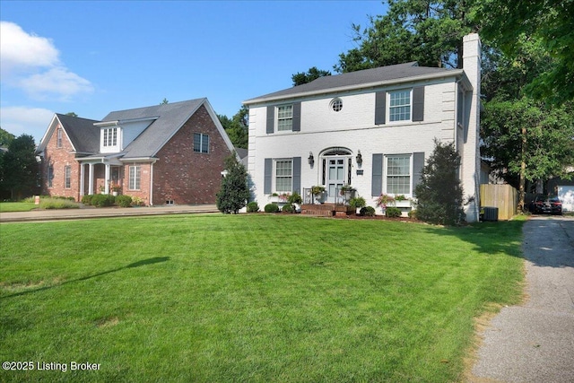 colonial inspired home with central AC and a front lawn