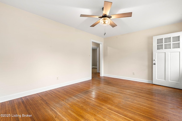 spare room featuring hardwood / wood-style flooring and ceiling fan