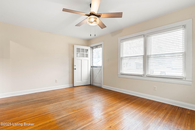 unfurnished room featuring ceiling fan and light wood-type flooring