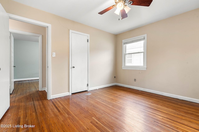 unfurnished bedroom featuring ceiling fan and wood-type flooring