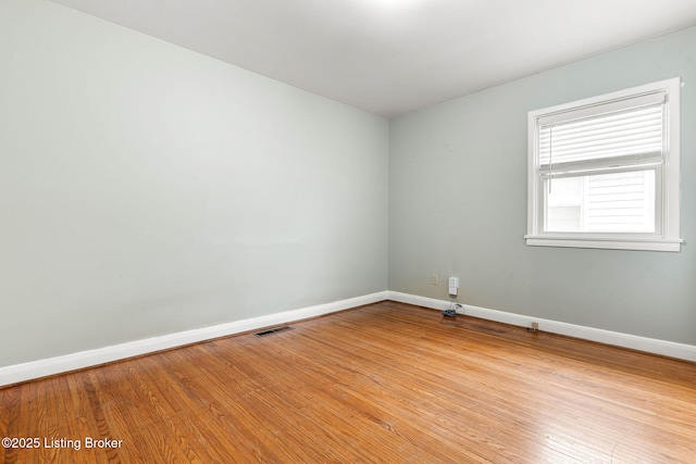 empty room with light hardwood / wood-style floors