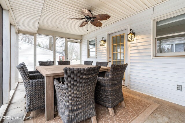 sunroom / solarium featuring ceiling fan