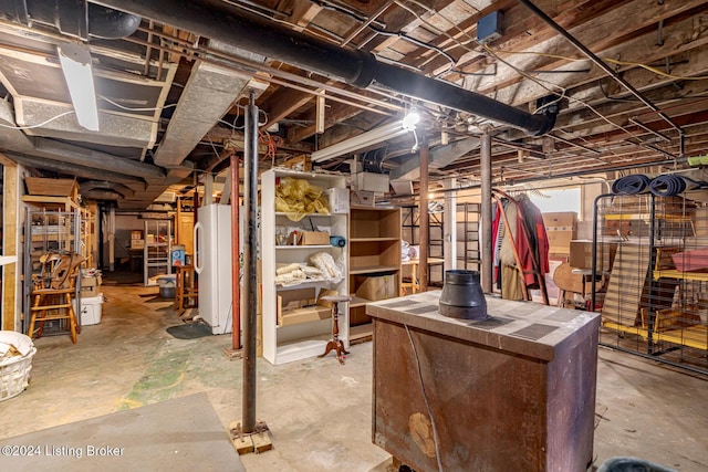 basement featuring white fridge