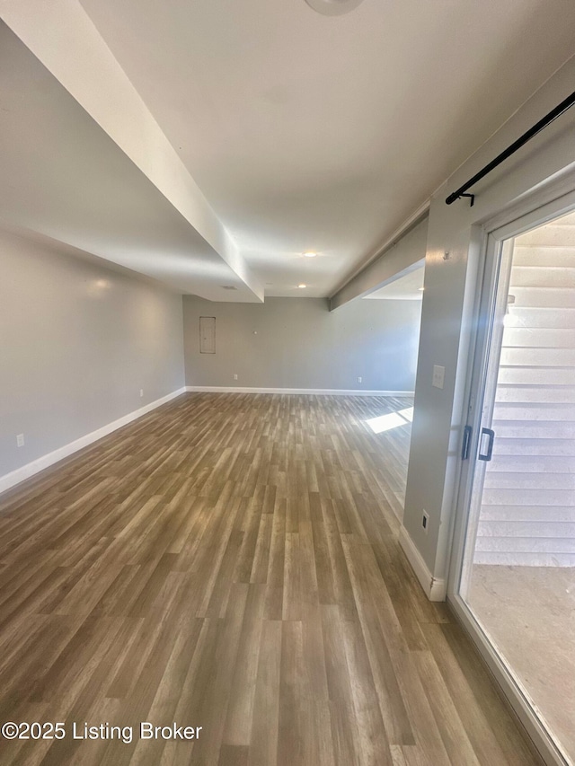 unfurnished room with wood-type flooring