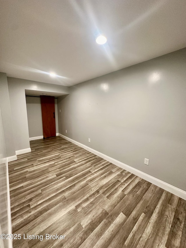 basement featuring hardwood / wood-style floors