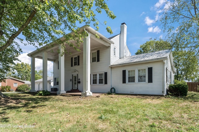 greek revival house with a front lawn