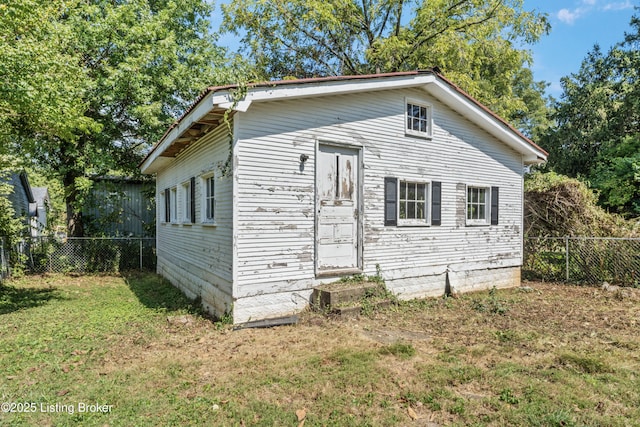 view of home's exterior featuring a yard