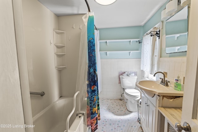 full bathroom featuring tile walls, vanity, shower / tub combo, toilet, and tile patterned floors