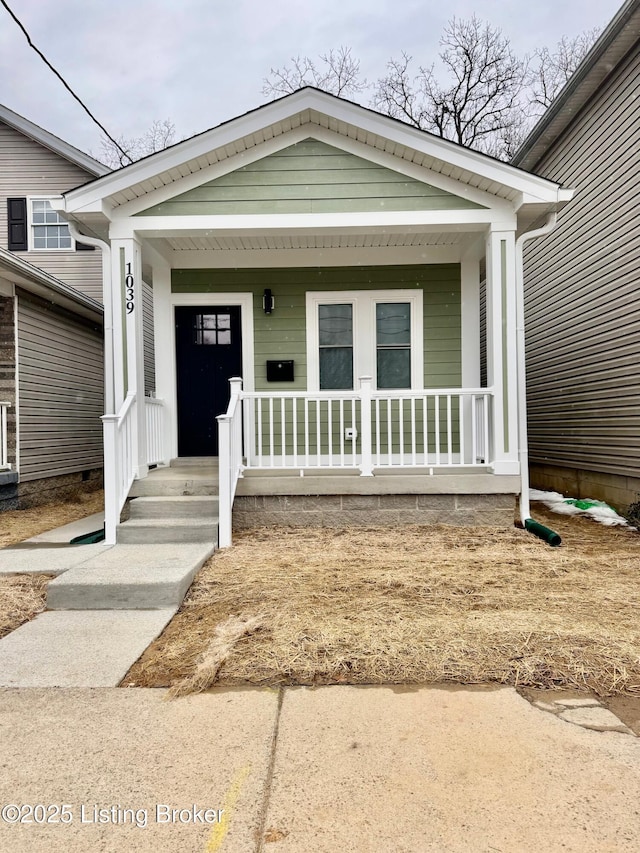 doorway to property featuring covered porch