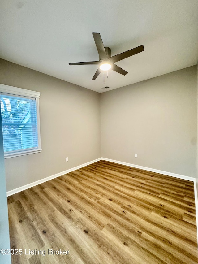 unfurnished room with ceiling fan and light hardwood / wood-style flooring