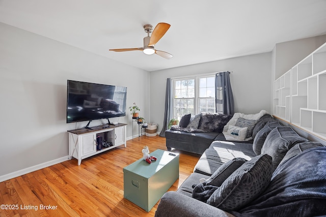 living room with hardwood / wood-style floors and ceiling fan