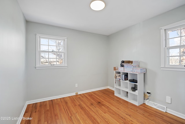 spare room featuring hardwood / wood-style flooring