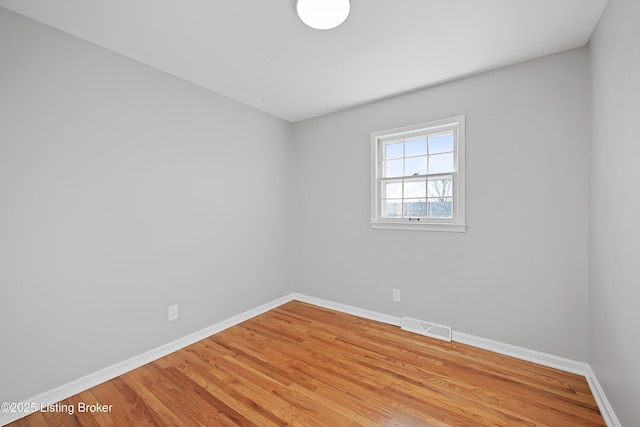 spare room featuring light hardwood / wood-style floors