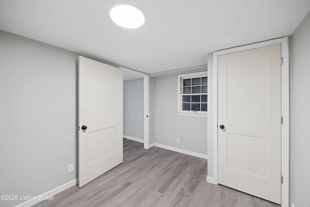 unfurnished bedroom with light hardwood / wood-style floors