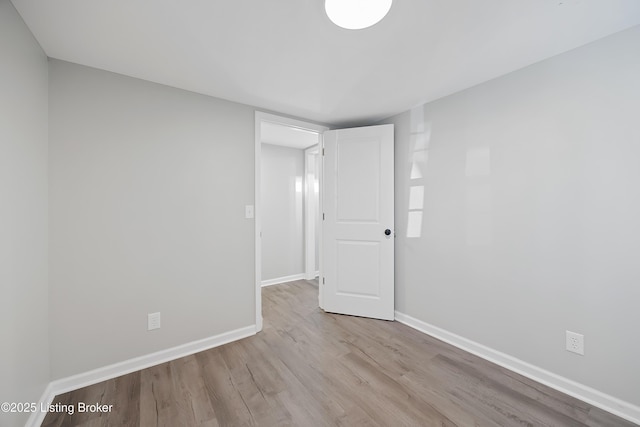 empty room with light hardwood / wood-style floors