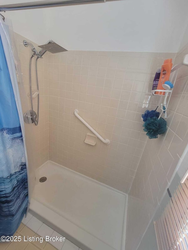 bathroom featuring tile patterned floors and a shower with shower curtain