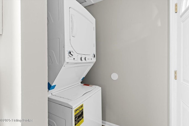 laundry room featuring stacked washer and clothes dryer