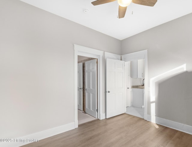 interior space featuring light hardwood / wood-style floors and ceiling fan