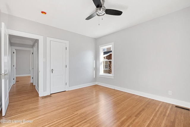 unfurnished bedroom featuring light hardwood / wood-style flooring and ceiling fan