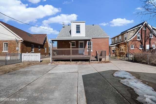 rear view of property featuring a porch