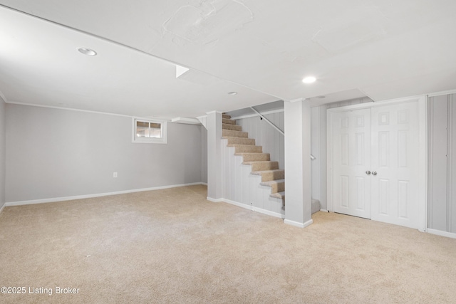 basement featuring light carpet