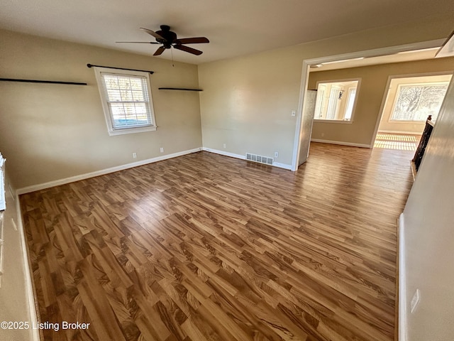 unfurnished room featuring hardwood / wood-style flooring and ceiling fan