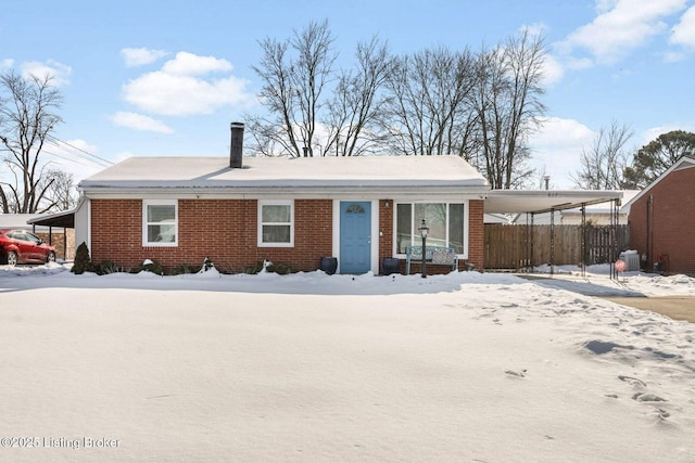 view of front of home featuring a carport