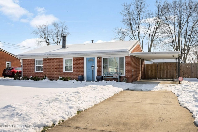 single story home featuring a carport