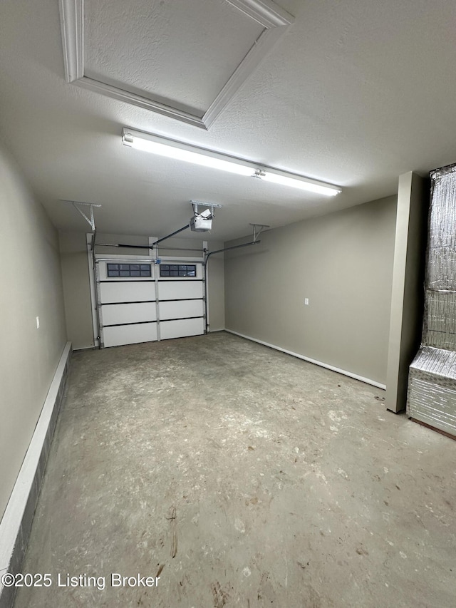 garage with baseboard heating and a garage door opener