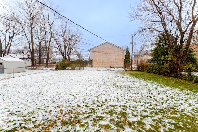 view of yard covered in snow